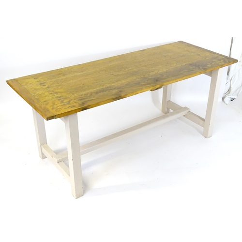 1696 - A vintage farmhouse / refectory table with a planked pine top and painted peg jointed base. 75