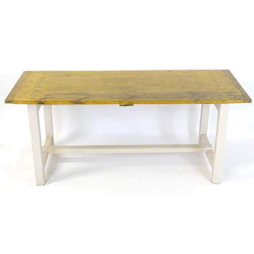 1696 - A vintage farmhouse / refectory table with a planked pine top and painted peg jointed base. 75