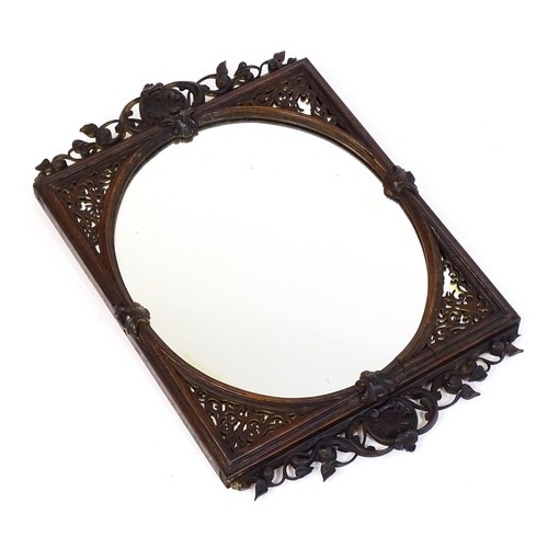 1699 - A 19thC carved rosewood mirror, with floral mouldings and a fretwork carved surround. 22