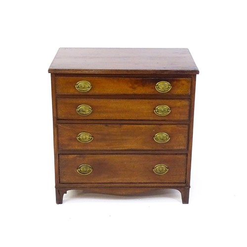 1702 - A late Georgian mahogany chest of drawers with a reeded top above four long graduated drawers with b... 