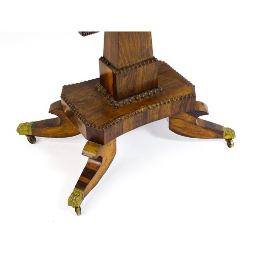 1704 - A 19thC rosewood card table, with a swivelling, folding table top above a tapering pedestal and a ba... 