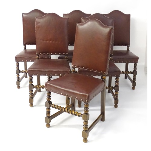 1705 - A set of six oak dining chairs with studded upholstery and block and turned legs with barley twist s... 