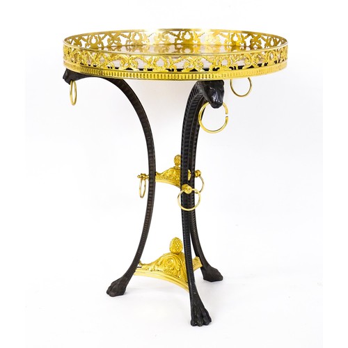 1706 - A tripod table with a marquetry inlaid top with a pierced gilt rim,, the base of cast metal construc... 