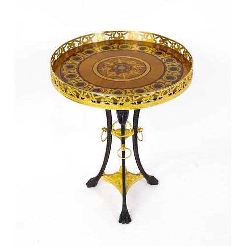 1706 - A tripod table with a marquetry inlaid top with a pierced gilt rim,, the base of cast metal construc... 