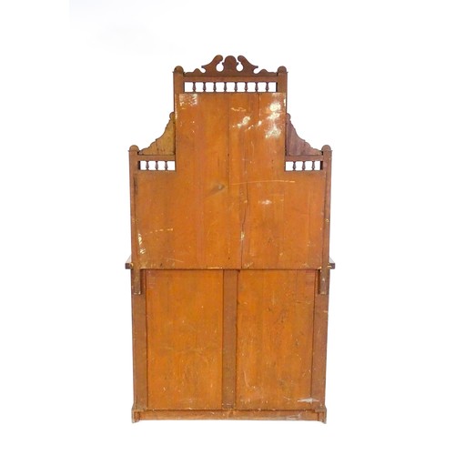 1710 - An Aesthetic movement mahogany chiffonier with a mirrored back, galleries of turned finials and reed... 