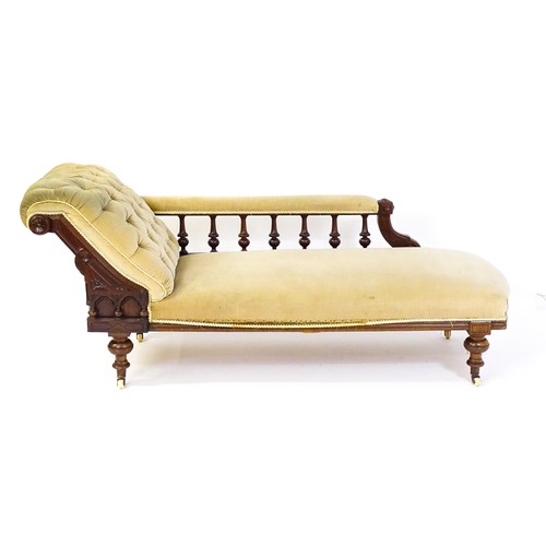 1717 - A late 19thC chaise longue with a turned gallery to the back supporting the arm, Greek key incising ... 