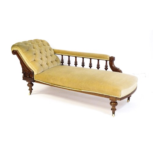 1717 - A late 19thC chaise longue with a turned gallery to the back supporting the arm, Greek key incising ... 