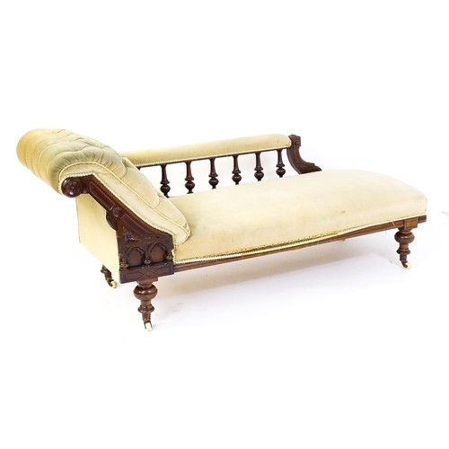 1717 - A late 19thC chaise longue with a turned gallery to the back supporting the arm, Greek key incising ... 