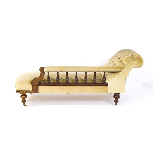 1717 - A late 19thC chaise longue with a turned gallery to the back supporting the arm, Greek key incising ... 