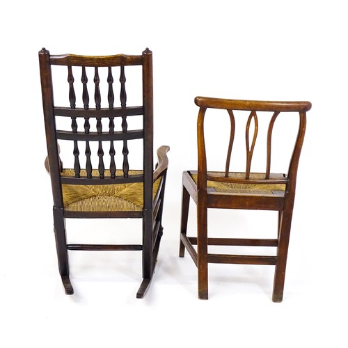 1727 - Two 19thC rush seated chairs, one a spindle back rocking chair, together with a side chair raised on... 