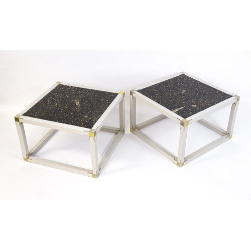 1613 - A pair of mid / late 20thC coffee tables with inset fossil marble tops, metal caps to the corners, a... 