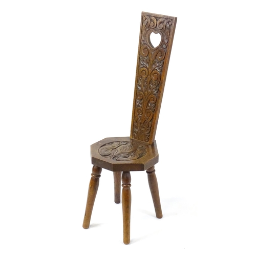 1738 - Local interest: Winslow, Buckinghamshire - An early / mid 20thC oak spinners chair with a carved bac... 