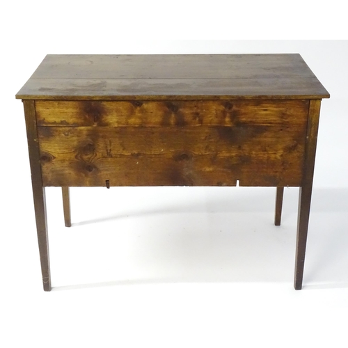 1744 - An early 19thC mahogany desk / sideboard, with a rectangular top above a fitted long drawer and two ... 