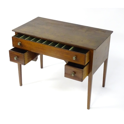 1744 - An early 19thC mahogany desk / sideboard, with a rectangular top above a fitted long drawer and two ... 