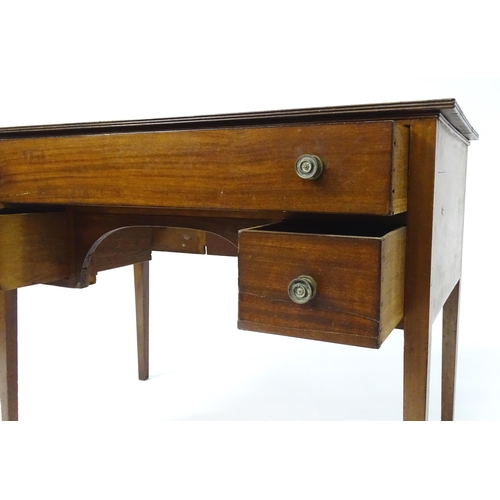 1744 - An early 19thC mahogany desk / sideboard, with a rectangular top above a fitted long drawer and two ... 