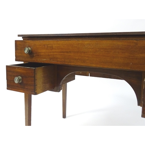 1744 - An early 19thC mahogany desk / sideboard, with a rectangular top above a fitted long drawer and two ... 