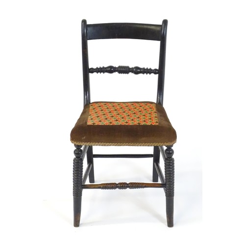 1748 - A 19thC ebonised side chair, having a bowed top rail above a turned mid rail and bobbin turned style... 