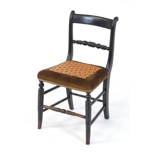 1748 - A 19thC ebonised side chair, having a bowed top rail above a turned mid rail and bobbin turned style... 