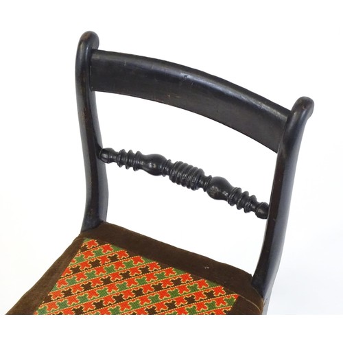 1748 - A 19thC ebonised side chair, having a bowed top rail above a turned mid rail and bobbin turned style... 