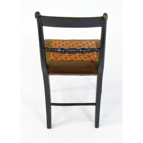 1748 - A 19thC ebonised side chair, having a bowed top rail above a turned mid rail and bobbin turned style... 