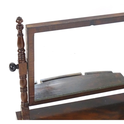 1755 - An early 19thC mahogany toilet mirror, having turned uprights and a rectangular mirror to the centre... 