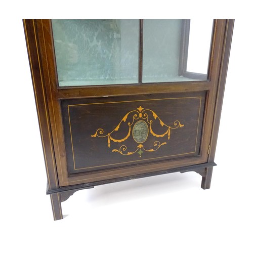 1760 - An early 20thC mahogany display cabinet, with a segmental pediment above a painted frieze and decora... 