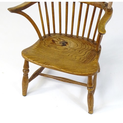 1767 - An early / mid 19thC Windsor chair of ash, elm and beech construction, having a double bow back, swe... 