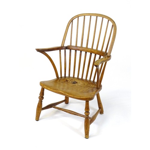 1767 - An early / mid 19thC Windsor chair of ash, elm and beech construction, having a double bow back, swe... 