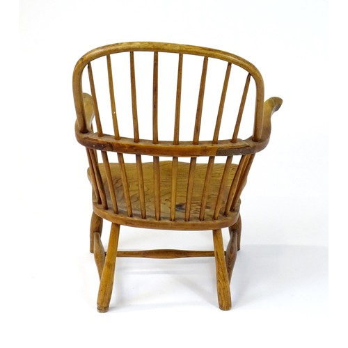 1767 - An early / mid 19thC Windsor chair of ash, elm and beech construction, having a double bow back, swe... 