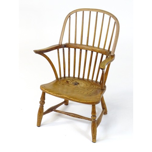 1767 - An early / mid 19thC Windsor chair of ash, elm and beech construction, having a double bow back, swe... 