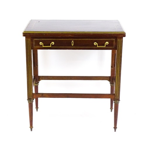 1780 - A 19thC mahogany card table with gilt brass mounts, brass inlay and a hinged, folding top, the top r... 