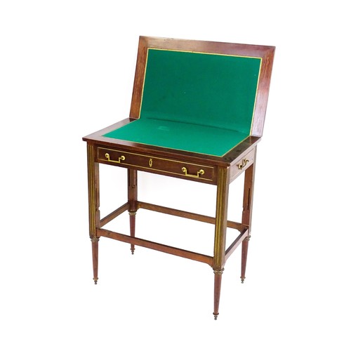 1780 - A 19thC mahogany card table with gilt brass mounts, brass inlay and a hinged, folding top, the top r... 