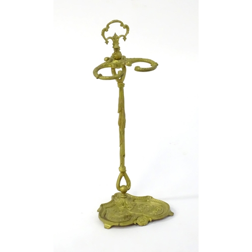 1783 - A late 20thC cast metal stick stand of small proportions, with a pierced handle and drip tray to the... 