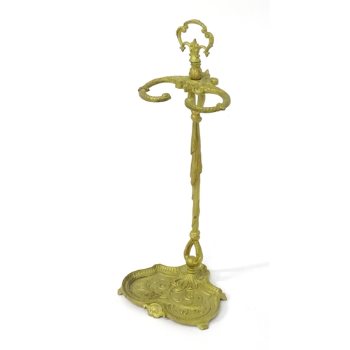 1783 - A late 20thC cast metal stick stand of small proportions, with a pierced handle and drip tray to the... 