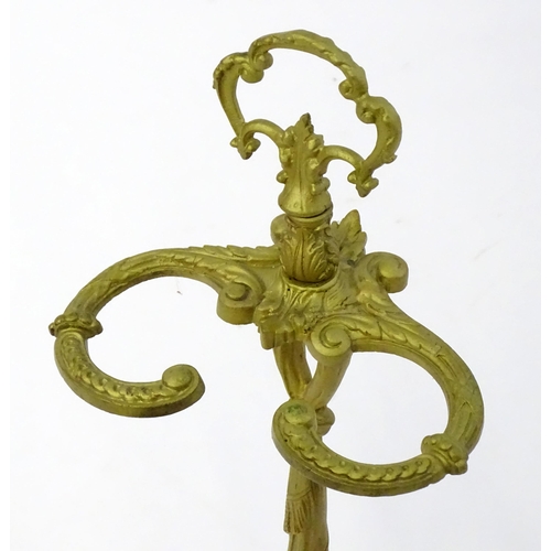 1783 - A late 20thC cast metal stick stand of small proportions, with a pierced handle and drip tray to the... 