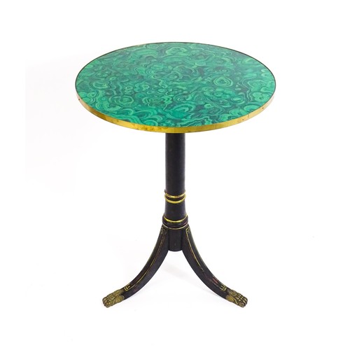 1786 - A Regency style tripod table with a circular top above an ebonised gilt highlighted base with three ... 