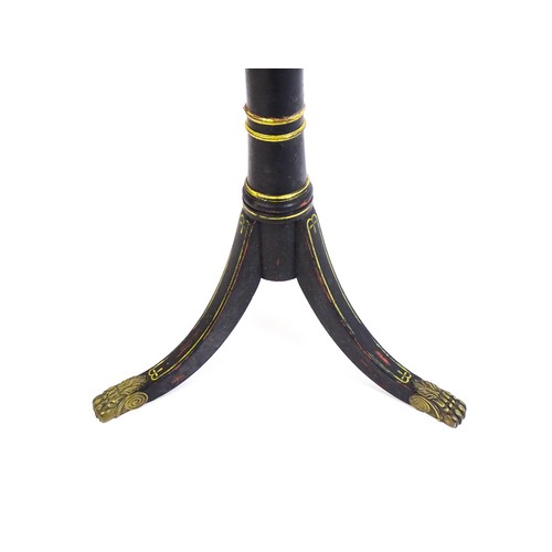 1786 - A Regency style tripod table with a circular top above an ebonised gilt highlighted base with three ... 