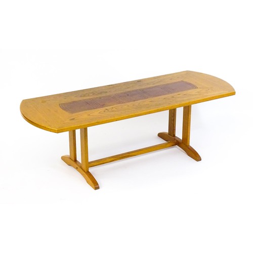 1791 - Vintage / Retro: An oak G-Plan coffee table with an inset leather top raised on rectangular supports... 