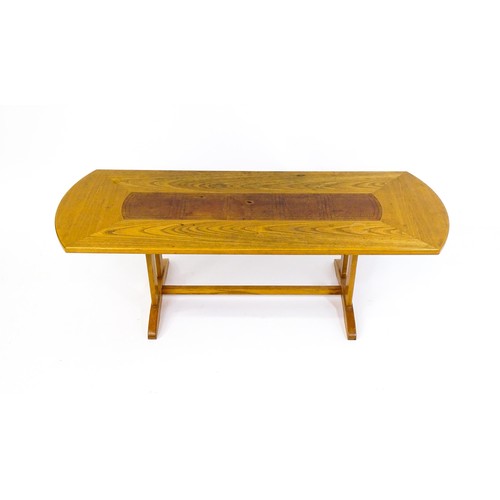 1791 - Vintage / Retro: An oak G-Plan coffee table with an inset leather top raised on rectangular supports... 