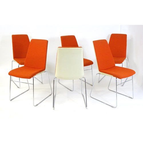 1793 - A set of six mid century stacking chairs, with orange and cream upholstery and raised on chromed tub... 