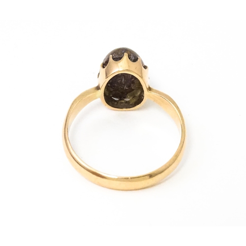 619 - A 9ct gold ring set with black opal, hallmarked Birmingham 1938, maker J. M. Ring size approx. N