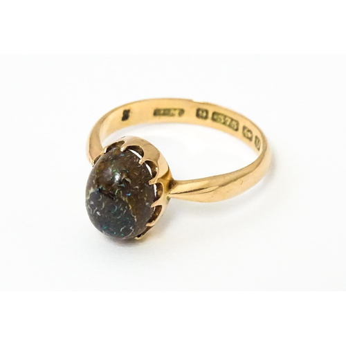 619 - A 9ct gold ring set with black opal, hallmarked Birmingham 1938, maker J. M. Ring size approx. N