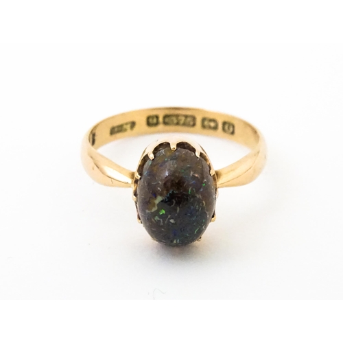 619 - A 9ct gold ring set with black opal, hallmarked Birmingham 1938, maker J. M. Ring size approx. N