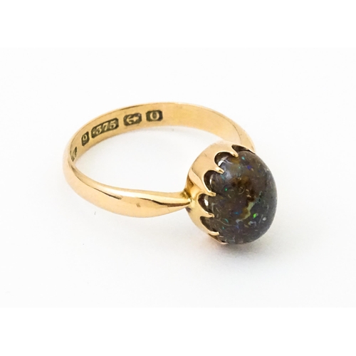 619 - A 9ct gold ring set with black opal, hallmarked Birmingham 1938, maker J. M. Ring size approx. N