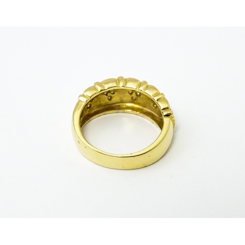 624 - A 14ct gold ring set with diamonds. Ring size approx. M 1/2