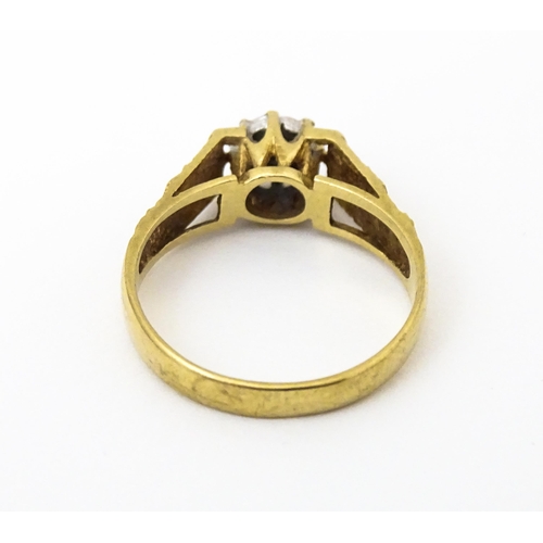 625 - A 9ct gold ring set with an illusion set diamond with engraved detail to shoulders. Ring size approx... 