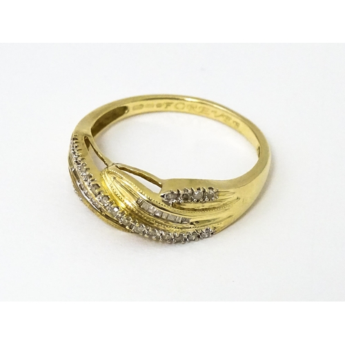 637 - A 14ct gold with twist detail set with diamonds. Ring size approx. Q 1/2