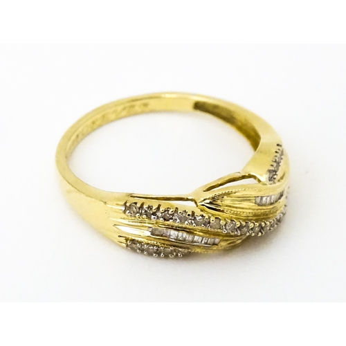 637 - A 14ct gold with twist detail set with diamonds. Ring size approx. Q 1/2