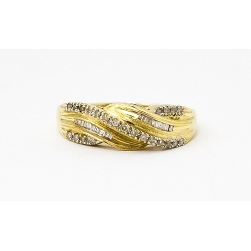 637 - A 14ct gold with twist detail set with diamonds. Ring size approx. Q 1/2