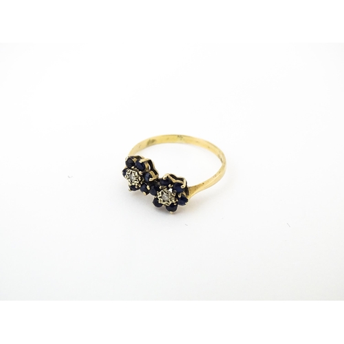 642 - A 9ct gold ring set with diamonds and spinel. Ring size approx. L